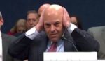 Postmaster General Louis DeJoy covered his ears while being chastised by Rep. Rich McCormick during a House Oversight and Accountability Committee hearing in Washington, D.C., on Tuesday.