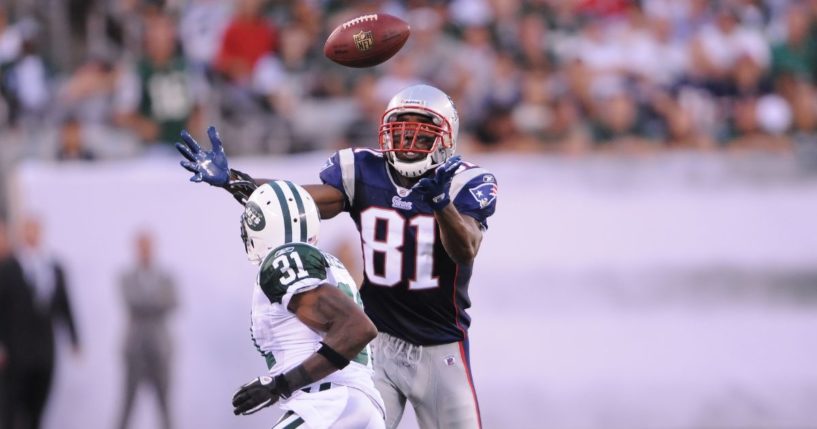 Randy Moss #81 of the New England Patriots goes up to catch a pass in a game against the New York Jets on Sept. 19, 2010.