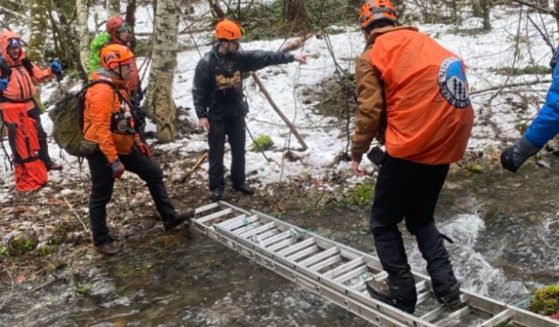 Volunteer search and rescue personnel help the Skamania County Sheriff’s Office search for two men who went missing on Christmas Eve in Oregon.