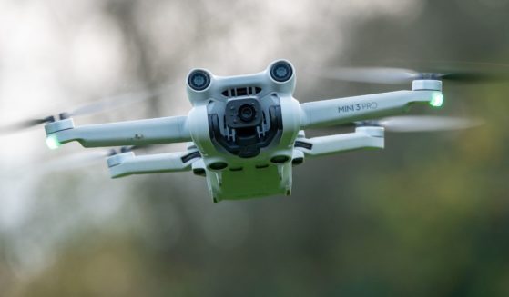 A DJI drone, a Mini 3 Pro, flies above the ground in Glastonbury, England, on Nov. 28.