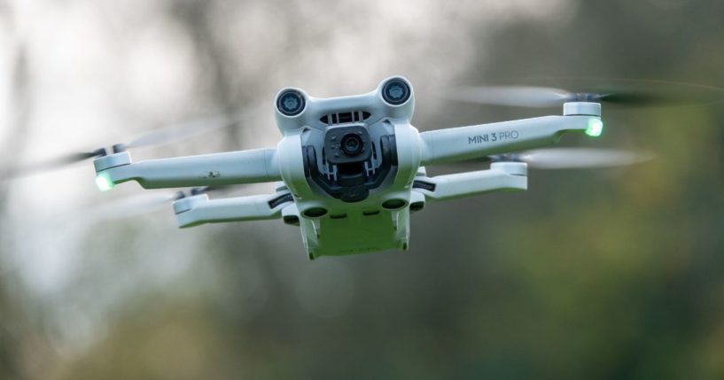 A DJI drone, a Mini 3 Pro, flies above the ground in Glastonbury, England, on Nov. 28.