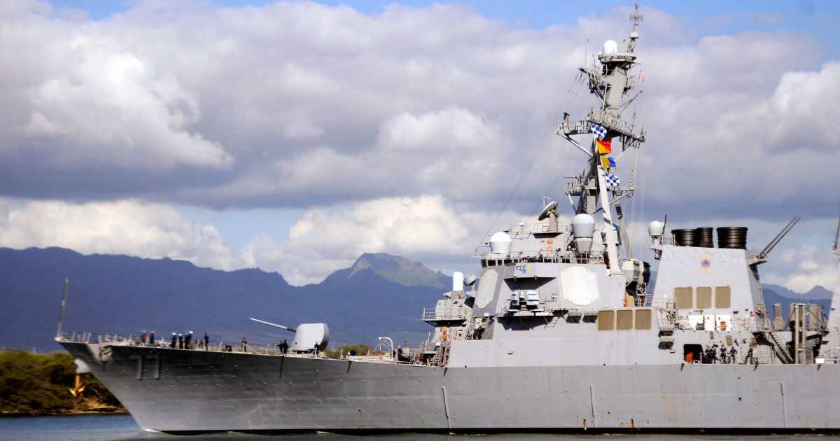 The guided-missile destroyer USS O'Kane (DDG 77) makes its way out of Pearl Harbor in Honolulu, Hawaii, on Feb. 27, 2010.