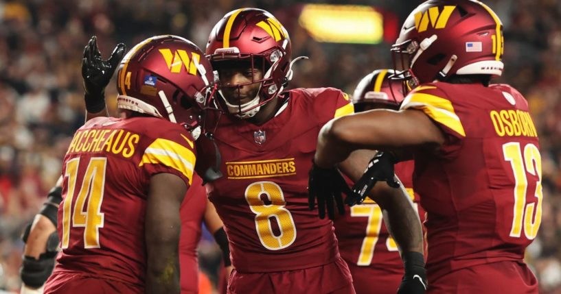 Players on the Washington Commanders celebrate after scoring a touchdown in their game against the Atlanta Falcons in Landover, Maryland, on Sunday.