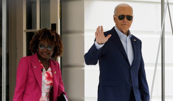 U.S. President Joe Biden walks to board Marine One with White House Press Secretary Karine Jean-Pierre on the South Lawn of the White House on April 18, 2024 in Washington, DC.