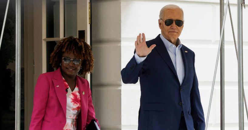 U.S. President Joe Biden walks to board Marine One with White House Press Secretary Karine Jean-Pierre on the South Lawn of the White House on April 18, 2024 in Washington, DC.