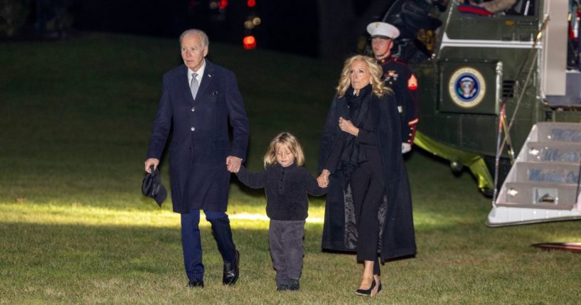 U.S. President Joe Biden, grandson Beau Biden and first lady Jill Biden walk off Marine One on the south lawn at the White House on December 19, 2024 in Washington, DC.