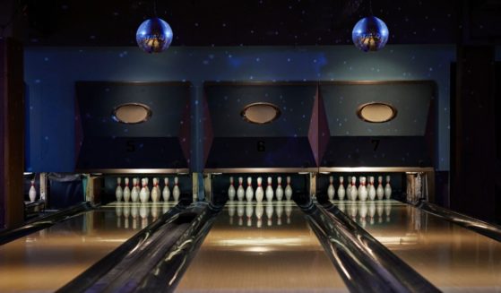 This Getty stock image shows a lit up bowling alley.