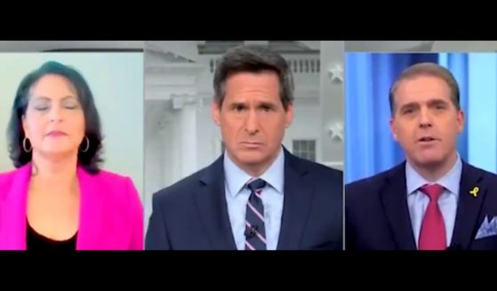 This X screen shot shows a discussion on a CNN panel involving John Brennan (C), Karen Finney (L) and Scott Jennings (R).