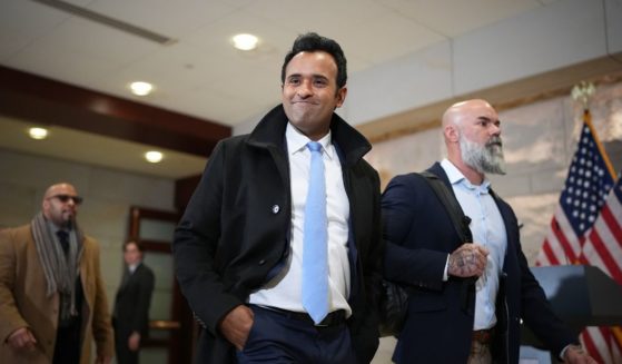 Businessman Vivek Ramaswamy (C), Co-Chair of the newly announced Department of Government Efficiency (DOGE), arrives at the U.S. Capitol for a media availability with Tesla CEO Elon Musk, Co-Chair of the newly announced Department of Government Efficiency and Speaker of the House Mike Johnson (R-LA) on December 5, 2024 in Washington, DC.