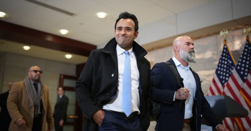 Businessman Vivek Ramaswamy (C), Co-Chair of the newly announced Department of Government Efficiency (DOGE), arrives at the U.S. Capitol for a media availability with Tesla CEO Elon Musk, Co-Chair of the newly announced Department of Government Efficiency and Speaker of the House Mike Johnson (R-LA) on December 5, 2024 in Washington, DC.