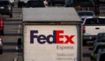 A FedEx tractor trailer sits in traffic on southbound Interstate 5 during the afternoon commute on March 12, 2024 in San Diego, California.