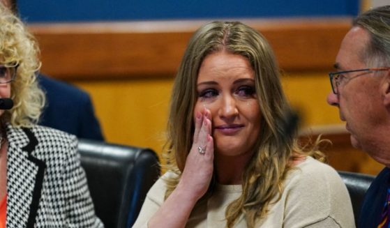 Jenna Ellis reacts with her lawyers after reading a statement pleading guilty to one felony count of aiding and abetting false statements and writings inside Fulton Superior Court Judge Scott McAfee's Fulton County Courtroom in Atlanta, Georgia, on October 24, 2023.