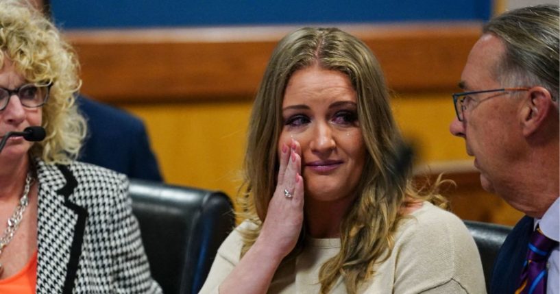 Jenna Ellis reacts with her lawyers after reading a statement pleading guilty to one felony count of aiding and abetting false statements and writings inside Fulton Superior Court Judge Scott McAfee's Fulton County Courtroom in Atlanta, Georgia, on October 24, 2023.