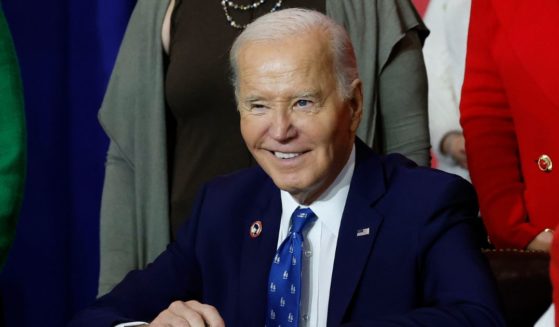 U.S. President Joe Biden, joined by lawmakers and labor leaders, signs a proclamation establishing the Frances Perkins National Monument during a ceremony at the Department of Labor on December 16, 2024 in Washington, DC.