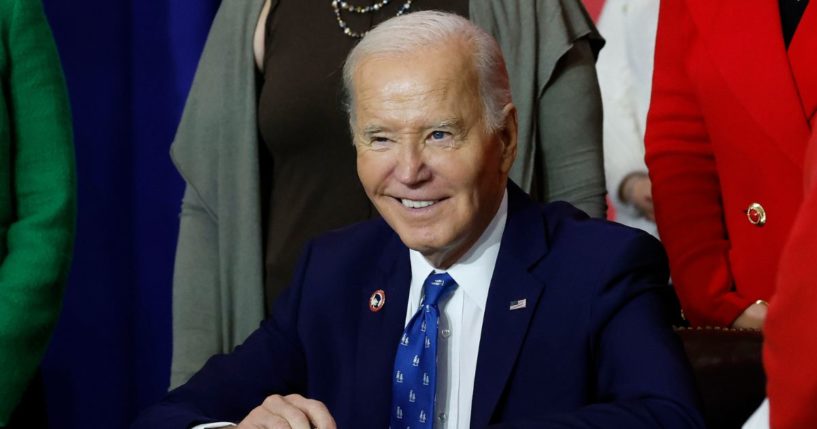 U.S. President Joe Biden, joined by lawmakers and labor leaders, signs a proclamation establishing the Frances Perkins National Monument during a ceremony at the Department of Labor on December 16, 2024 in Washington, DC.