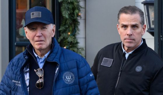 A November 29, 2024 photo shows US President Joe Biden and son Hunter Biden stepping out of a bookstore while shopping in Nantucket. Massachusetts.