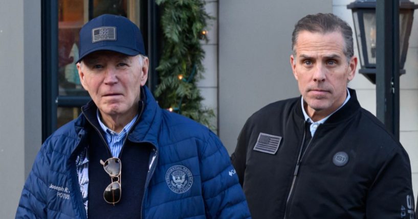 A November 29, 2024 photo shows US President Joe Biden and son Hunter Biden stepping out of a bookstore while shopping in Nantucket. Massachusetts.