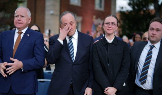 (L-R) Failed Democratic vice presidential nominee, Minnesota Gov. Tim Walz, Second gentleman Doug Emhoff, Ella Emhoff and Cole Emhoff react after Democratic presidential nominee, U.S. Vice President Kamala Harris conceded the election in a speech at Howard University on November 6, 2024 in Washington, DC.