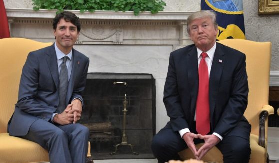 Then-and-future US President Donald Trump (R) and Canadian Prime Minister Justin Trudeau look on during their meeting at the White House in Washington, DC, on October 11, 2017.