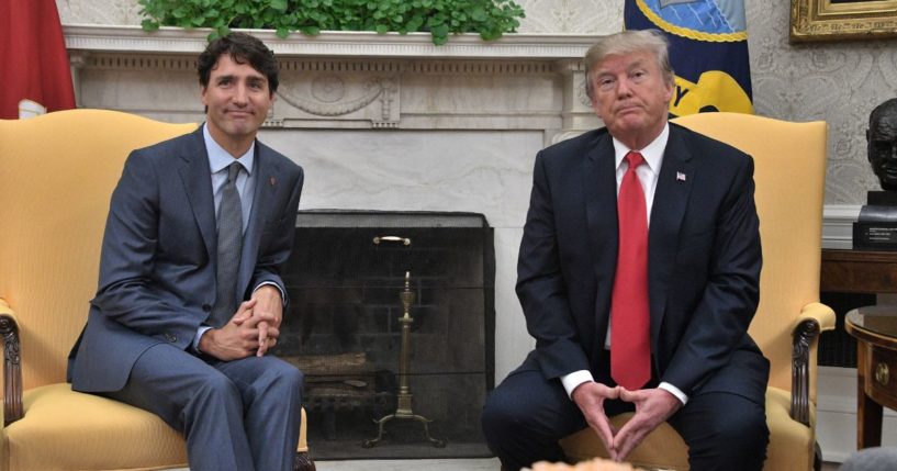 Then-and-future US President Donald Trump (R) and Canadian Prime Minister Justin Trudeau look on during their meeting at the White House in Washington, DC, on October 11, 2017.