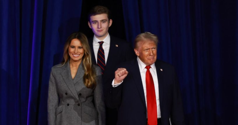 U.S. President-elect Donald Trump arrives to speak with first lady Melania Trump and Barron Trump during an election night event at the Palm Beach Convention Center on November 6, 2024 in West Palm Beach, Florida.