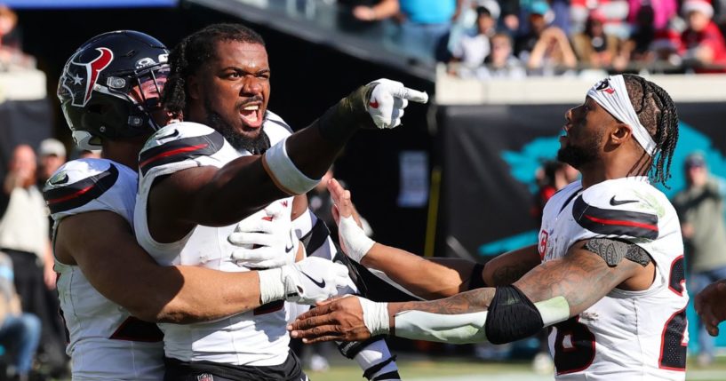 Azeez Al-Shaair #0 of the Houston Texans points to the Jacksonville Jaguars bench after a fight and being ejected during the second quarter of a game at EverBank Stadium on December 1, 2024 in Jacksonville, Florida.