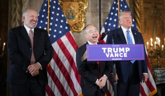 SoftBank CEO Masayoshi Son delivers remarks alongside U.S. President-elect Donald Trump and Trump's choice for Secretary of Commerce, Cantor Fitzgerald Chairman and CEO Howard Lutnick (L) at Trump’s Mar-a-Lago resort on December 16, 2024 in Palm Beach, Florida.