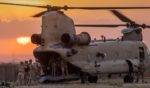 U.S. Army soldiers board a CH-47 Chinook helicopter while departing a remote combat outpost known as RLZ on May 25, 2021 near the Turkish border in northeastern Syria.