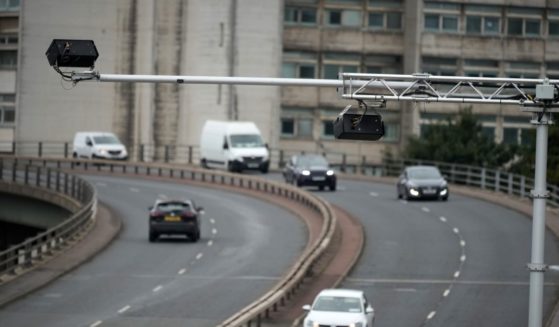 An AI safety camera monitors and records traffic on Mancunian Way in Manchester, England, on Sept. 5.