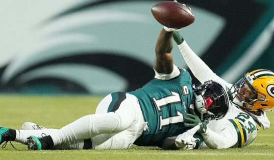 A.J. Brown of the Philadelphia Eagles catches a pass in front of Carrington Valentine of the Green Bay Packers in the first quarter during the NFC Wild Card Playoff in Philadelphia, Pennsylvania, on Sunday.