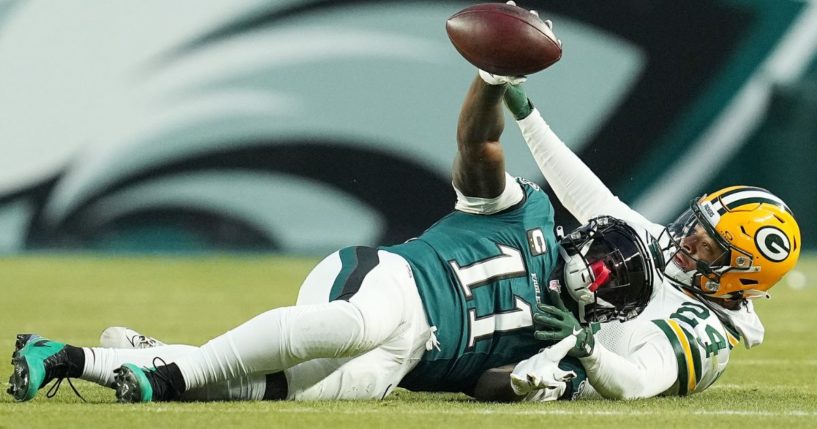 A.J. Brown of the Philadelphia Eagles catches a pass in front of Carrington Valentine of the Green Bay Packers in the first quarter during the NFC Wild Card Playoff in Philadelphia, Pennsylvania, on Sunday.