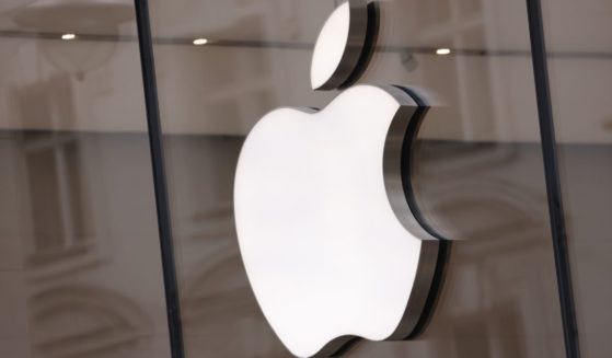 The Apple logo hangs on an Apple Store in Berlin, Germany, on March 24.