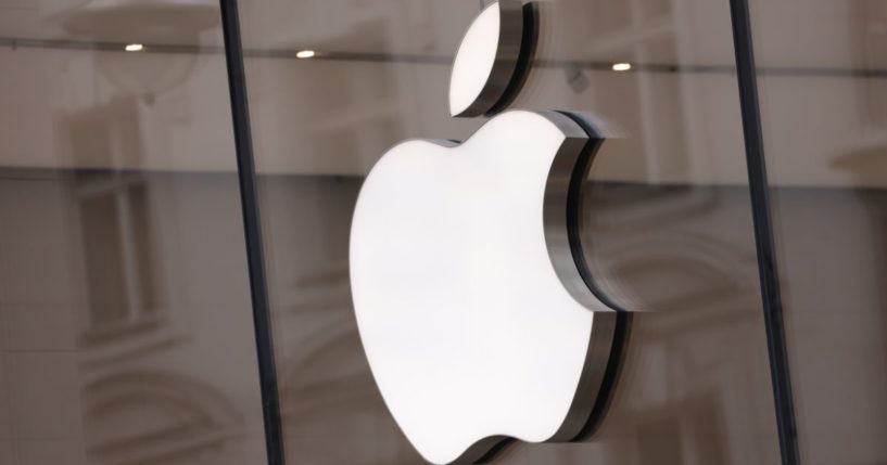 The Apple logo hangs on an Apple Store in Berlin, Germany, on March 24.