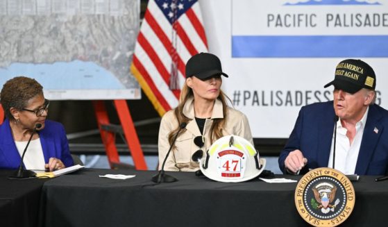 Los Angeles Mayor Karen Bass and First Lady Melania Trump look on as President Donald Trump speaks during a fire emergency briefing at Station 69 in Pacific Palisades, a neighborhood of Los Angeles, California, on January 24, 2025.