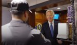 President Joe Biden asks a man behind a service desk at the White House to make him a milkshake.