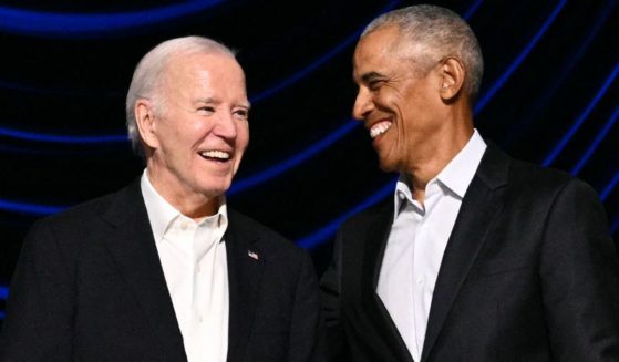 Then-President Joe Biden, left, laughs onstage with former President Barack Obama, right, during a campaign fundraiser in Los Angeles, California, on June 15.