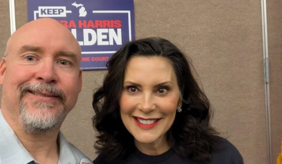 Lenawee County Democratic Party Chairman Bill Swift pictured with Michigan Gov. Gretchen Whitmer.