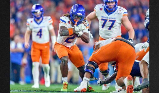 Boise State Broncos running back Ashton Jeanty (2) runs with the football in action during the 2024 Vrbo Fiesta Bowl between the Penn State Nittany Lions and Boise State Broncos at State Farm Stadium Tuesday in Glendale, Arizona.