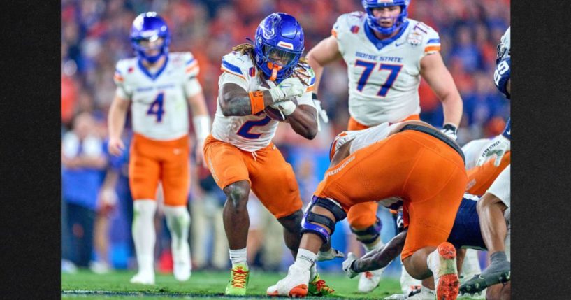 Boise State Broncos running back Ashton Jeanty (2) runs with the football in action during the 2024 Vrbo Fiesta Bowl between the Penn State Nittany Lions and Boise State Broncos at State Farm Stadium Tuesday in Glendale, Arizona.