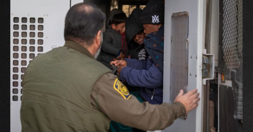 Immigrants prepare to be transported by the U.S. Border Patrol after crossing the U.S.-Mexico border Monday near Sasabe, Arizona. Immigrant families had passed through a gap in the Trump-built border wall hours before Donald J. Trump was inaugurated for a second time as President of the United States.