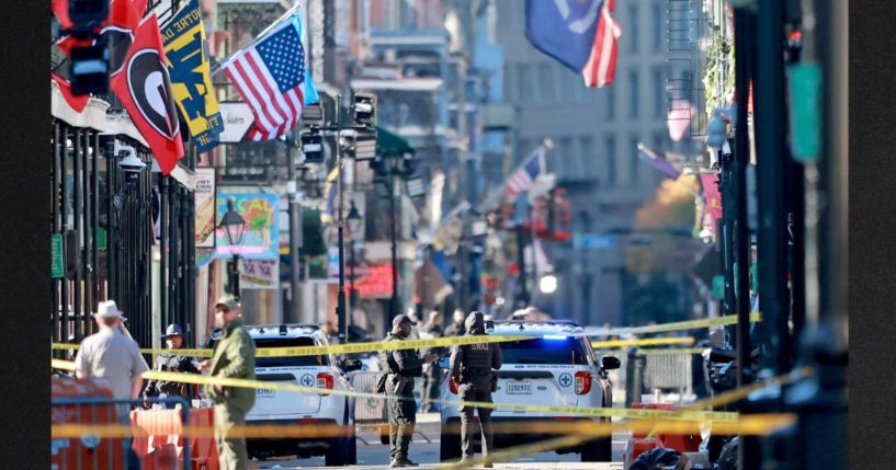 Law enforcement officers from multiple agencies work the scene on Bourbon Street after at least 14 people were killed when a person drove into the crowd in the early morning hours of New Year's Day Wednesday on Bourbon Street in New Orleans, Louisiana. Dozens more were injured after a suspect in a rented pickup truck allegedly drove around barricades and through a crowd of New Year's revelers.