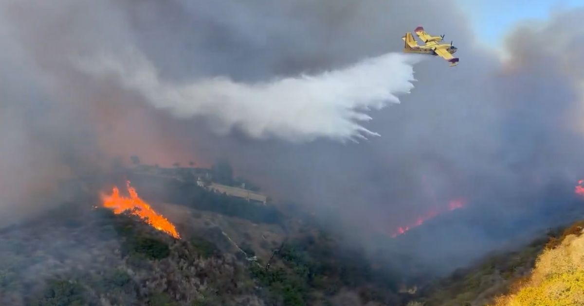 Watch: Pilot of Fire Tanker Floods Mountainside Hotspot with Absolutely Perfect Drop