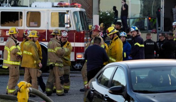 Firefighters and police respond to a plane crash in Fullerton, California, on Thursday.