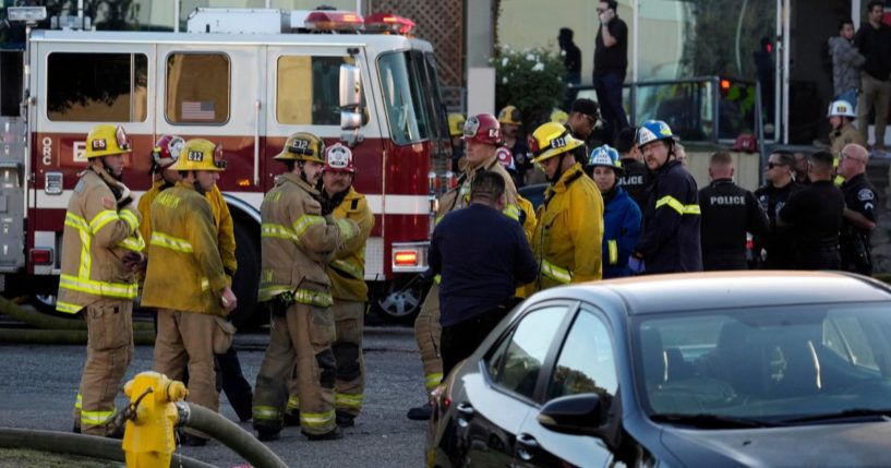 Firefighters and police respond to a plane crash in Fullerton, California, on Thursday.