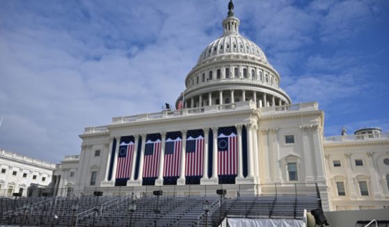 American flags are displayed Friday on the West Front of the U.S. Capitol building, where the presidential inauguration traditionally takes place in Washington, D.C.