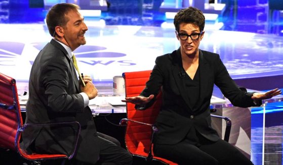 Chuck Todd, left, and Rachel Maddow are seen in a photo dated June 26, 2019, speaking to the audience during the Democratic presidential primary debate hosted by NBC News in Miami, Florida.