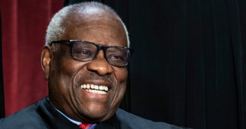 Supreme Court Justice Clarence Thomas waits to take a group photo with other justices at the Supreme Court building on Capitol Hill in Washington, D.C., on Oct. 7, 2022.