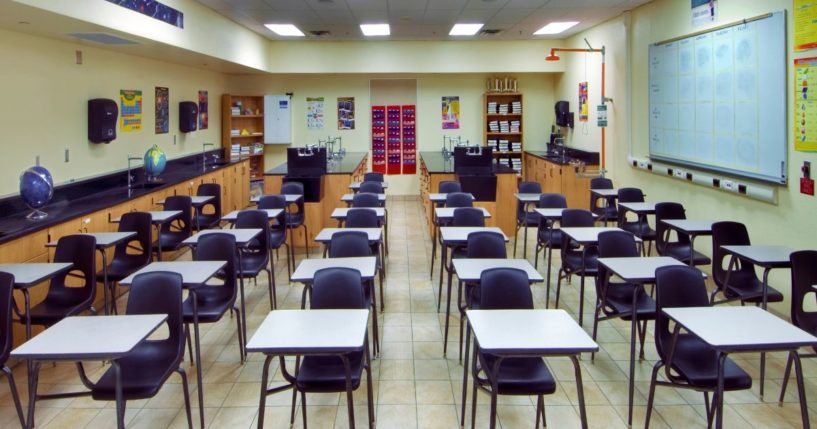 This stock image shows a high school science classroom.