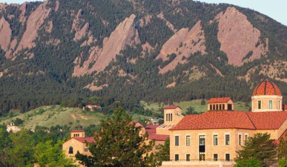 The flatirons behind a classroom building on the University of Colorado campus in Boulder, Colorado.