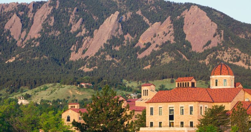 The flatirons behind a classroom building on the University of Colorado campus in Boulder, Colorado.